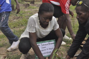 Patience Braimoh planting tree